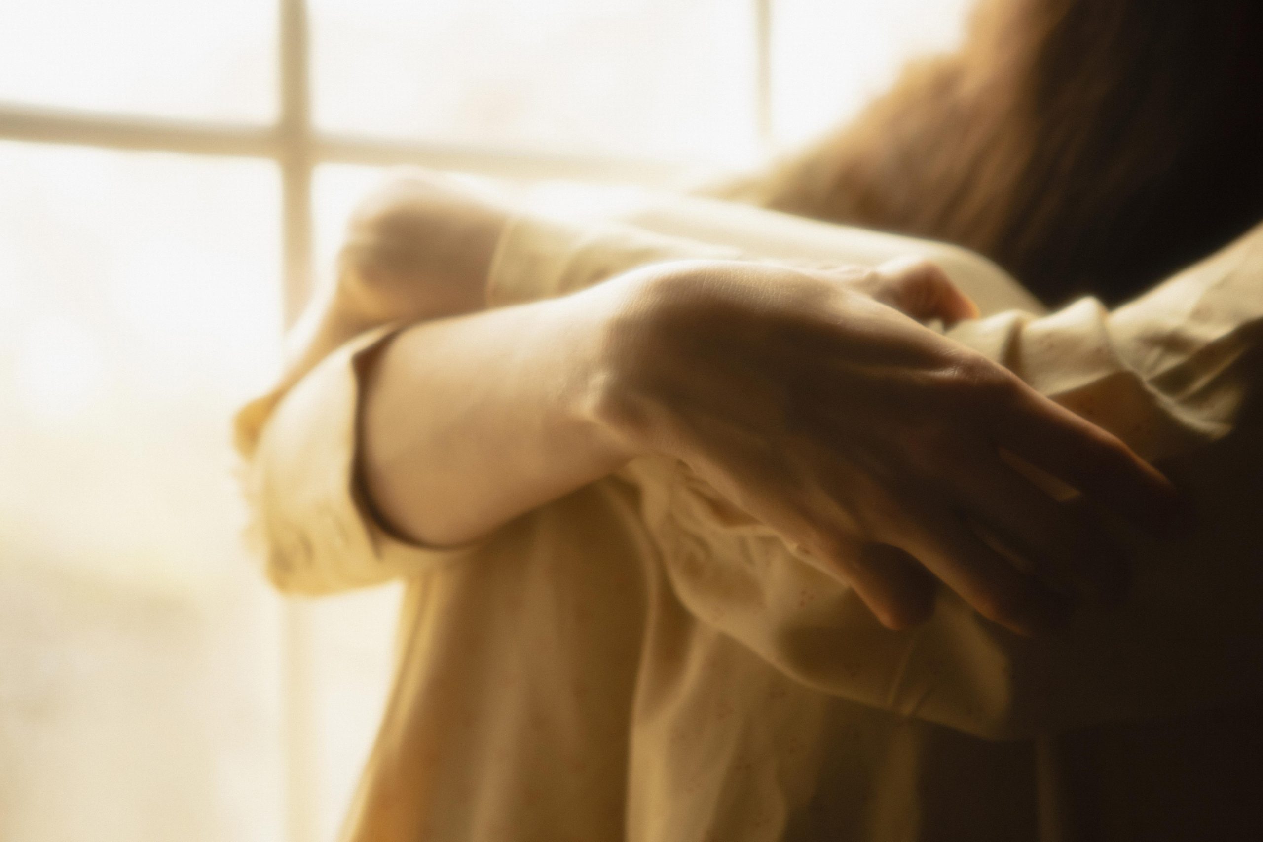 woman home with mysterious lights around her